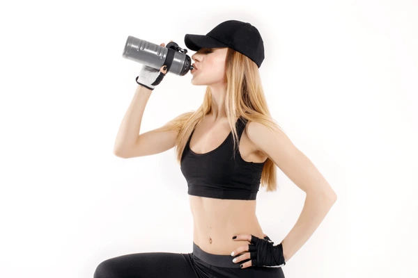 Australian athlete drinking a protein shake from OzPharmLabs product range